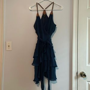 Wrap dress with leather straps, ruffles. Size small.